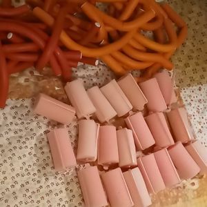 Spiral flexible and foam hair rollers.